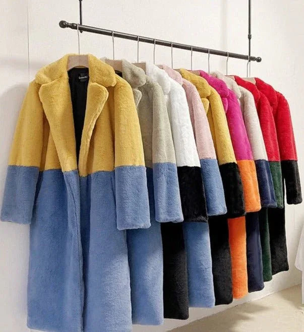 Assortment of colorful faux fur coats on rack