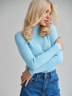 Woman wearing a white ribbed mock neck sweater - View 23 | WEUXS