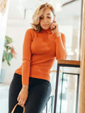 Woman wearing a white ribbed mock neck sweater - View 27 | WEUXS