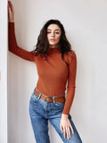 Woman wearing a white ribbed mock neck sweater - View 31 | WEUXS