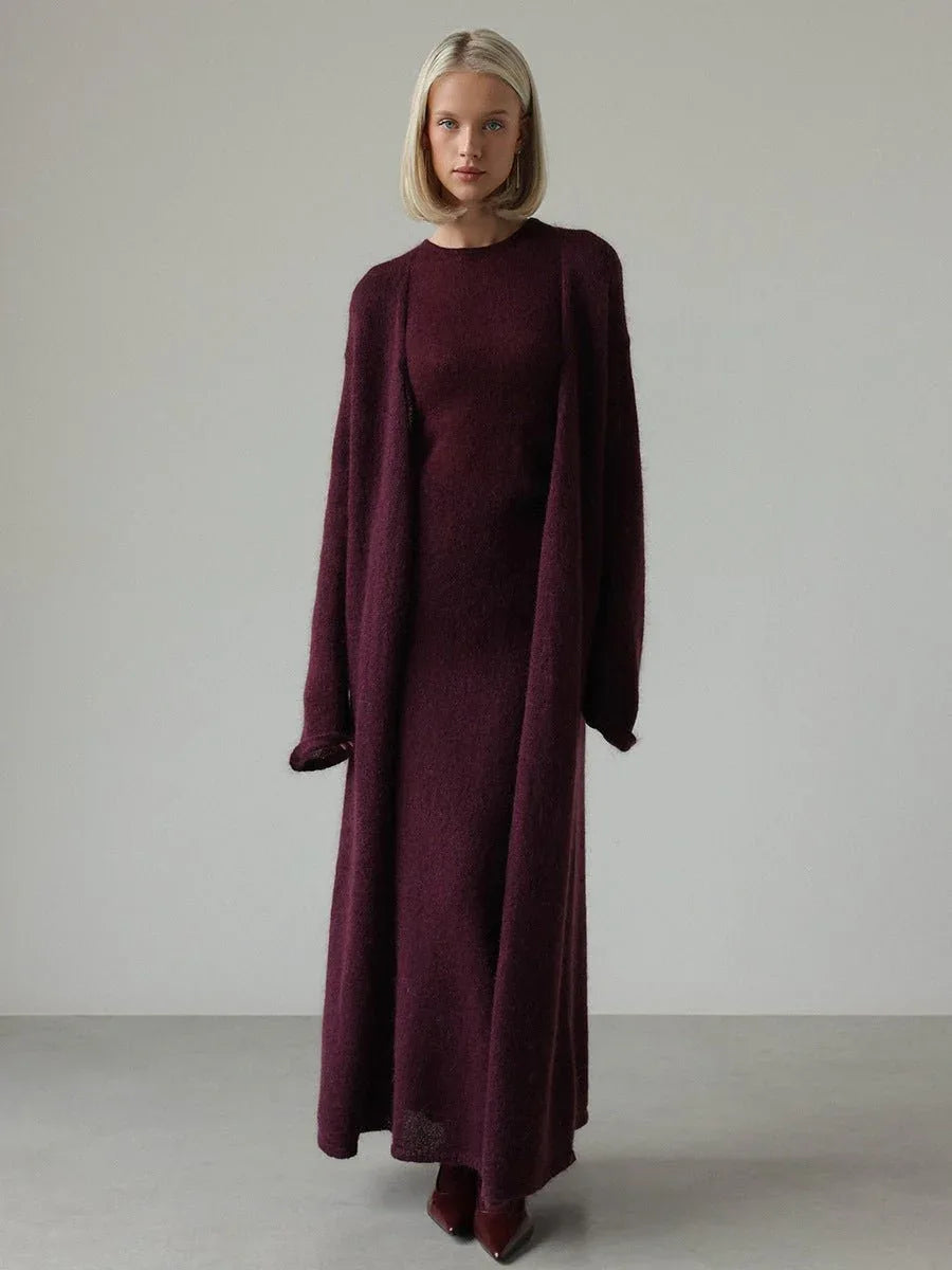 Woman in a deep purple knit maxi dress and matching long cardigan