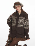 Close-up of a woman wearing a brown Fair Isle knit cardigan.