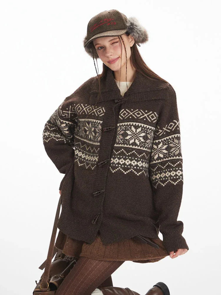 Close-up of a woman wearing a brown Fair Isle knit cardigan.