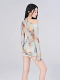 Rear view of the tie-dye mesh top and shorts.