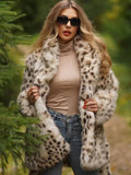 Woman wearing a spotted faux fur coat and sunglasses