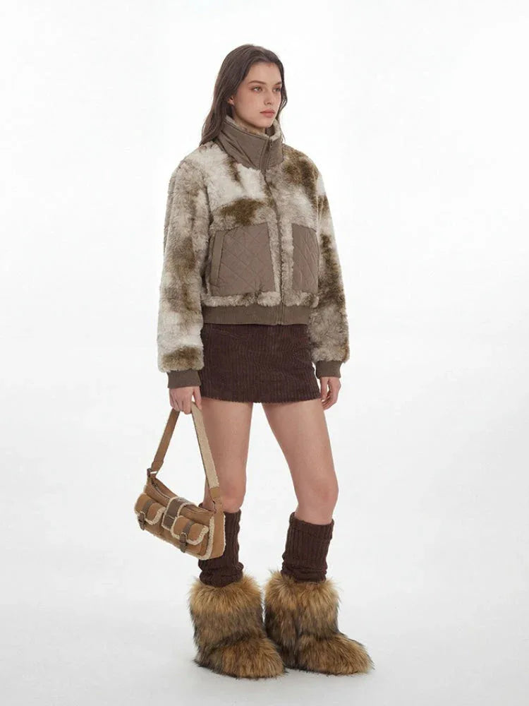 Side profile of a woman modeling a textured bomber jacket