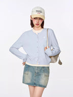 Light blue button-front cardigan with embroidered heart detail