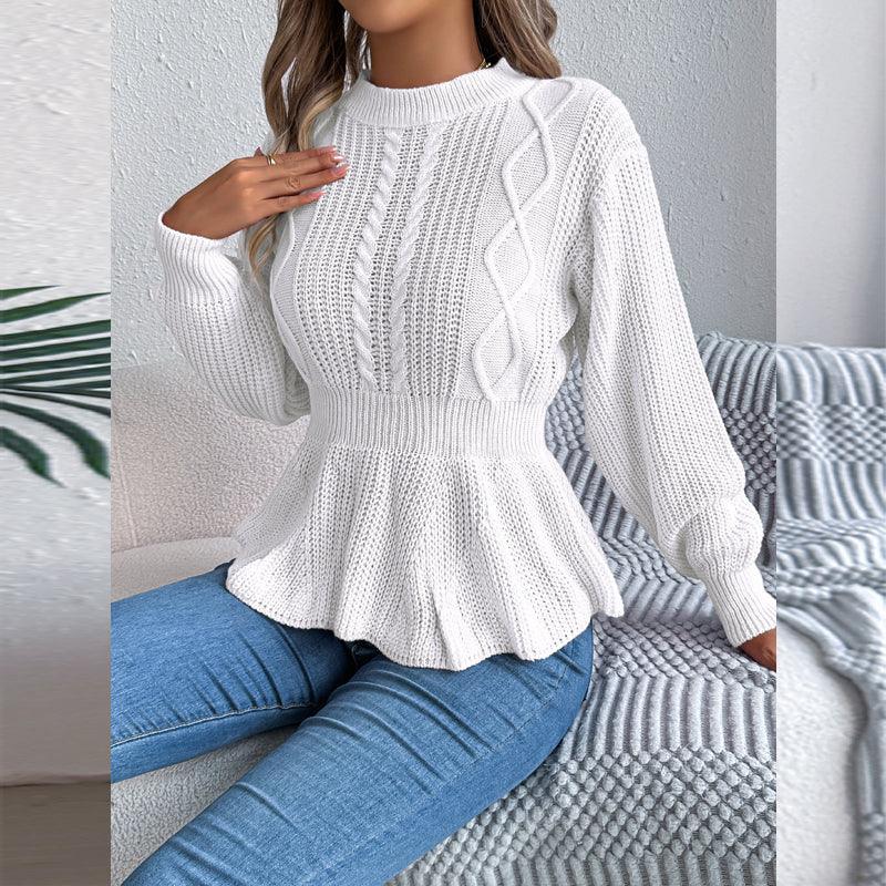 Close-up of a woman wearing a white peplum knit sweater with detailed stitching.