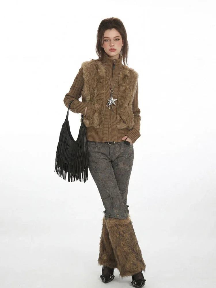 Model posing in a layered outfit featuring a faux fur vest and leg warmers.