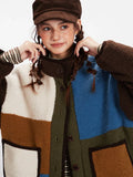 Detail of the collar and color-block pattern on a fleece jacket