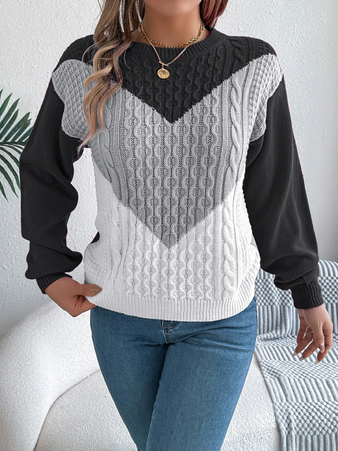 Close-up of the textured knit detail on a women's chevron sweater.