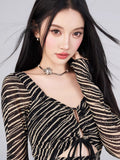 Close-up of the neckline and sleeve detail on a black and gold striped sheer mesh mini dress.