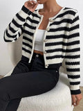 Front view of a black and white striped cropped cardigan