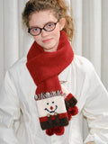 Full body shot of a woman styled with a red knit scarf and matching gloves