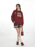 Back view of the relaxed fit holiday graphic sweater