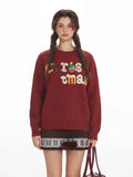 Full-length view of a woman styling the oversized holiday sweater