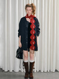 Model showcasing the unique design of the red festive scarf