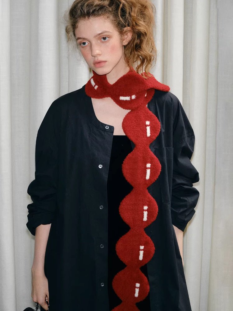 Full body shot of a model with the red circular knit scarf