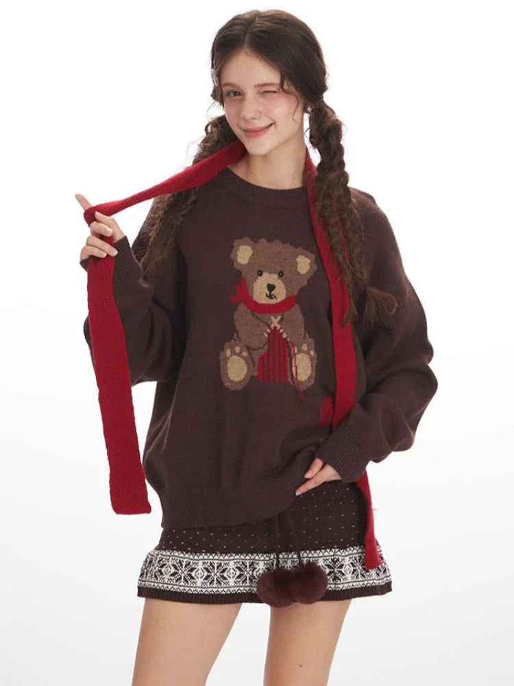 Model styling the brown knit sweater with a festive scarf.
