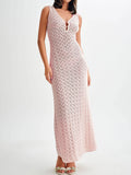 Woman from the back wearing a white sleeveless maxi knit dress