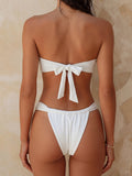 Back view of white strapless bikini top with adjustable tie closure.