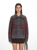 Close-up of the grey and red plaid collared knit jacket worn by a model.