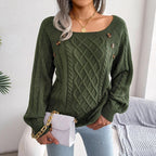 Woman wearing a green cable knit sweater with a square neckline and balloon sleeves