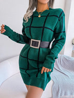 woman wearing a green plaid knit dress with a black belt