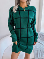 front view of a woman in a green plaid knit dress