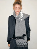 Full body shot of a woman styled with a grey dachshund scarf