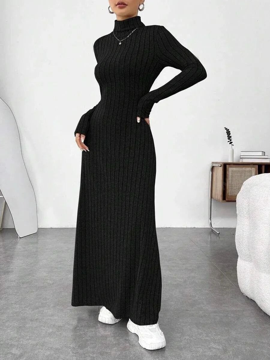 woman wearing a black ribbed knit maxi dress with a turtleneck and long sleeves