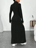 back view of a woman in a black ribbed knit maxi dress