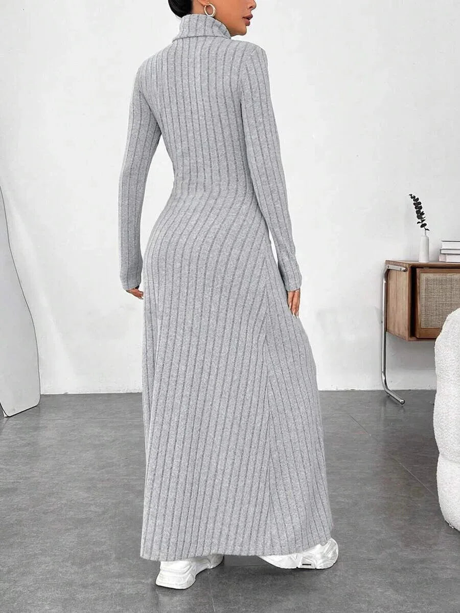 woman wearing a grey ribbed knit maxi dress with a turtleneck and long sleeves