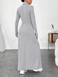 back view of a woman in a grey ribbed knit maxi dress