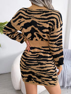 back view of a woman in a tan and black tiger print knit dress