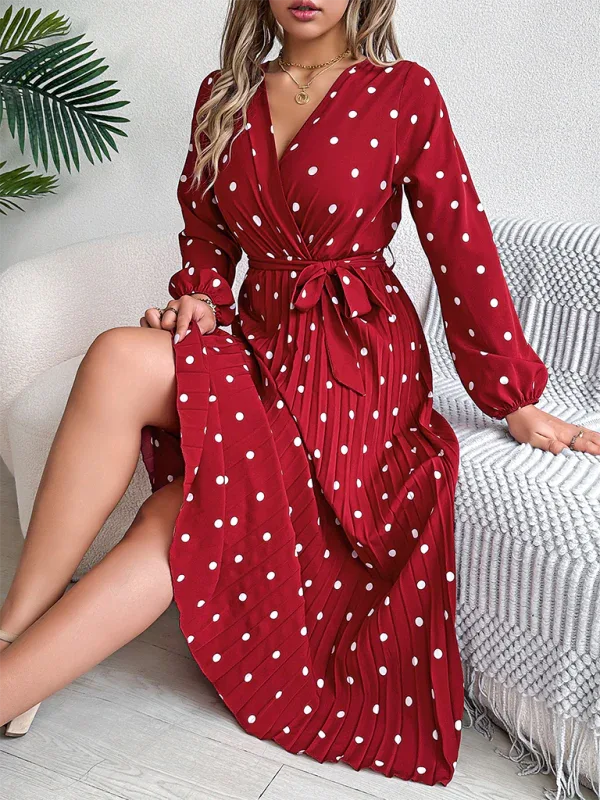 Close-up of a woman in a red polka dot midi dress