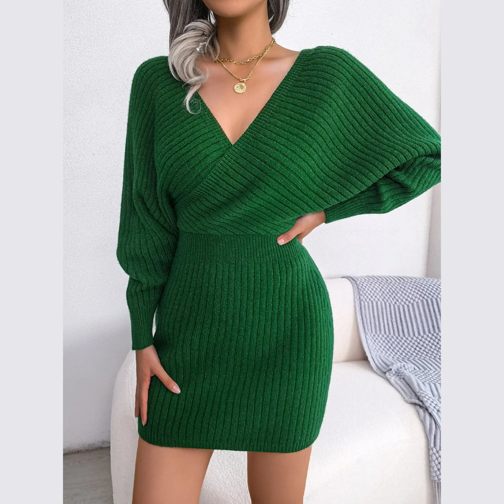 Green knit wrap mini dress with V-neck and bishop sleeves, front view