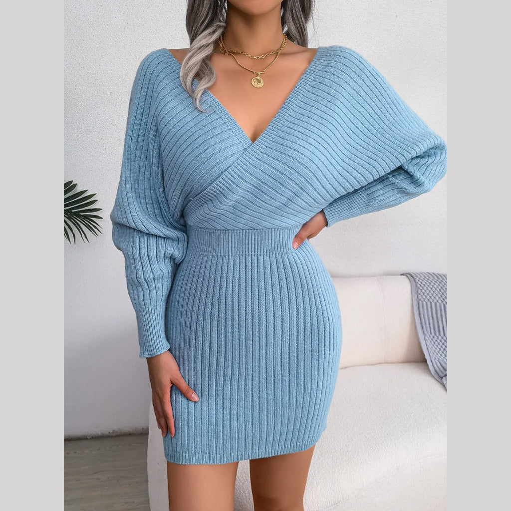 Front view of a blue knit wrap dress with bishop sleeves