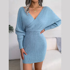 Front view of a blue knit wrap dress with bishop sleeves