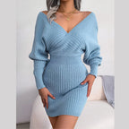 Woman wearing a blue ribbed knit V-neck wrap dress
