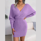 Side profile of a woman in a purple batwing sleeve knit dress