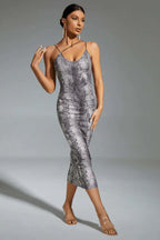 Woman wearing a grey snake print midi bodycon dress with spaghetti straps