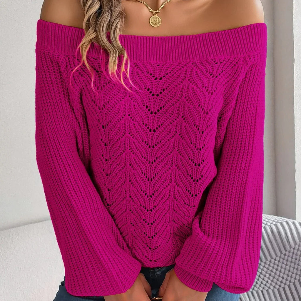 Woman wearing a magenta off-the-shoulder knit sweater with a detailed open-knit pattern on the front and long bishop sleeves.