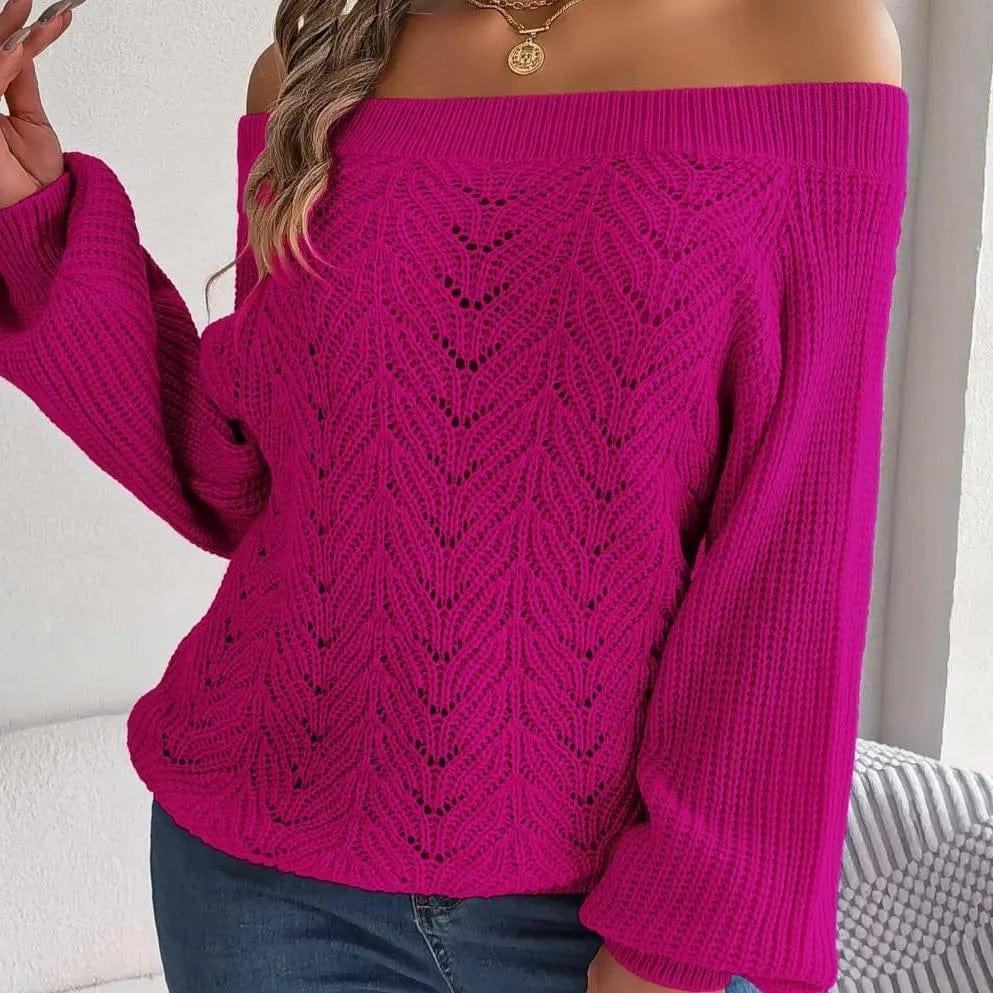 Front view of a woman in a magenta off-the-shoulder sweater showcasing its textured knit and voluminous sleeves.