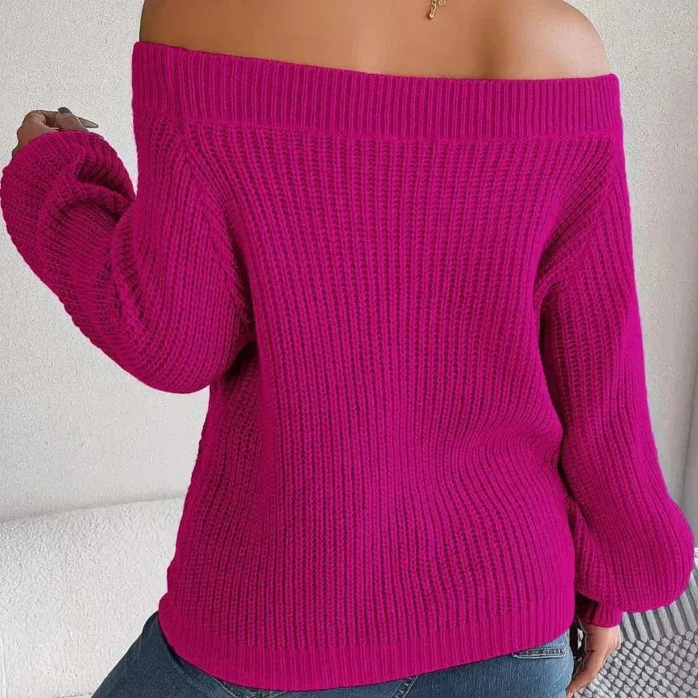 Back view of a woman in a magenta off-the-shoulder sweater, highlighting the ribbed detailing on the back and sleeves.