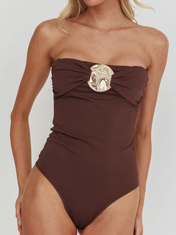 Brown strapless one-piece swimsuit with ruched front and gold embellishment