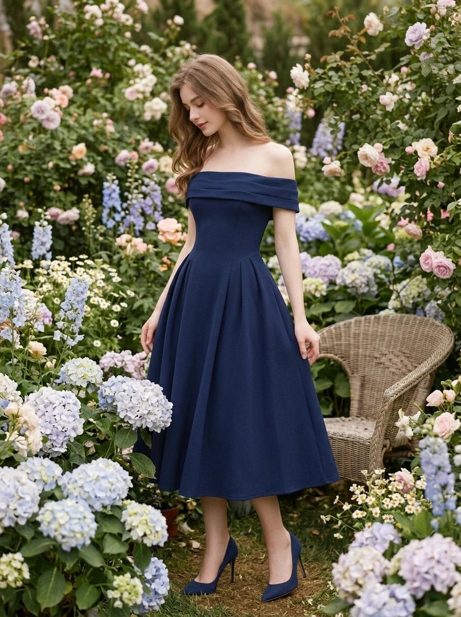 Woman wearing a navy blue off-the-shoulder dress among flowers