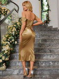 Rear view of a woman in a gold satin off-the-shoulder midi dress with a corset bodice.