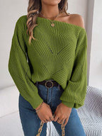 Close-up of the green off-the-shoulder knit sweater's texture