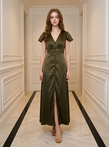 Woman wearing a long, olive green satin dress with a v-neck and button front